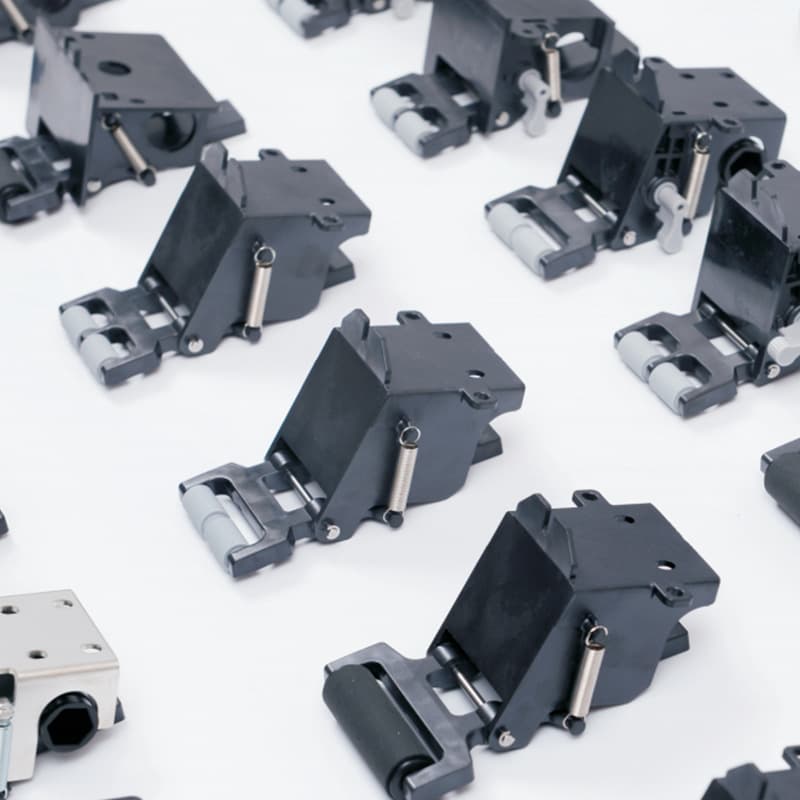 Two adjustable pressure rollers for six-color printing presses, adjustable tension springs for die-cutting machines, and labels for printing presses.