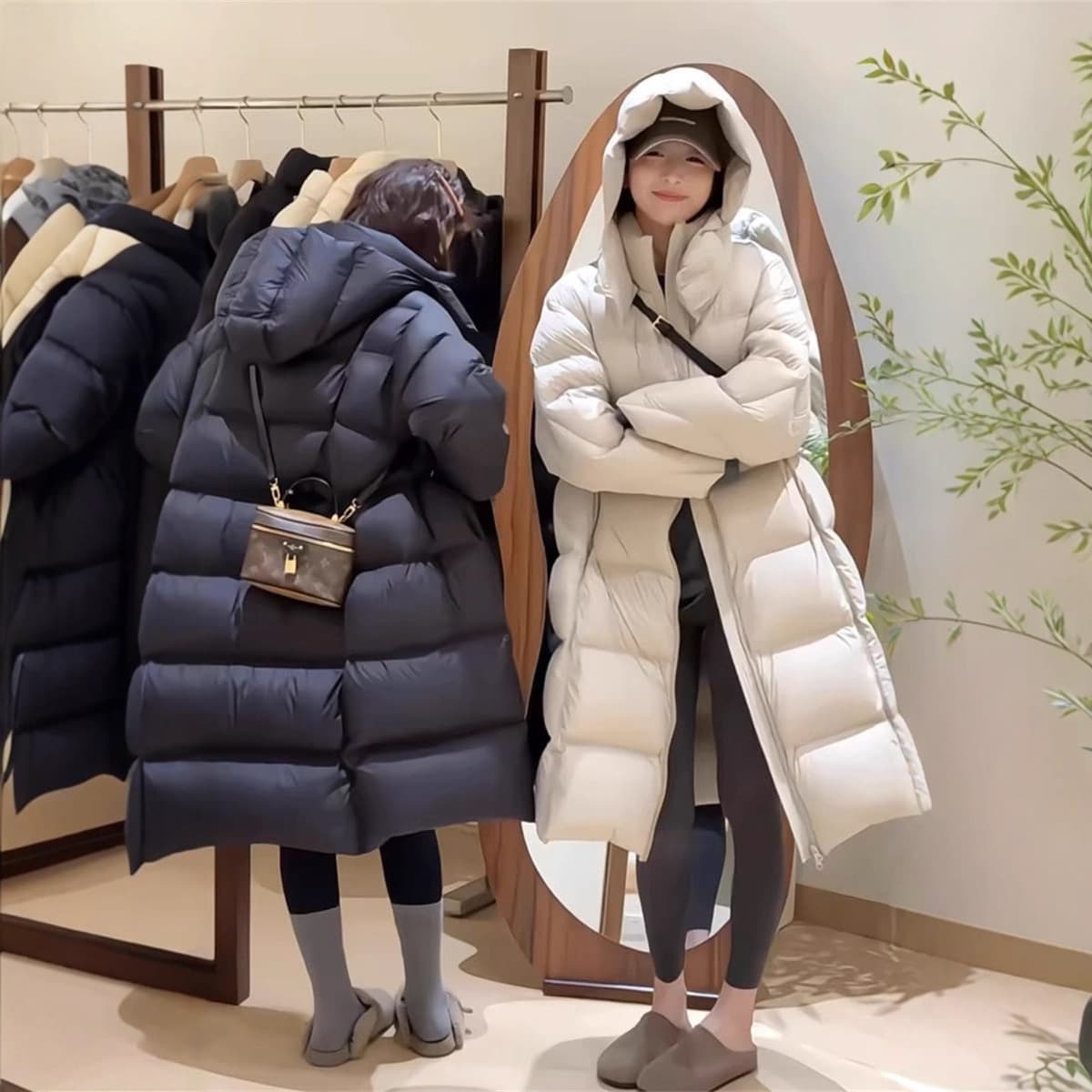 Women's long down jacket 2025 new winter loose slim fit thickened white duck down petite design sense hit style