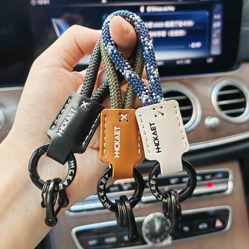 Leather braided rope key chain pendant, high quality car key chain ring, men's and women's hand rope, school bag pendant