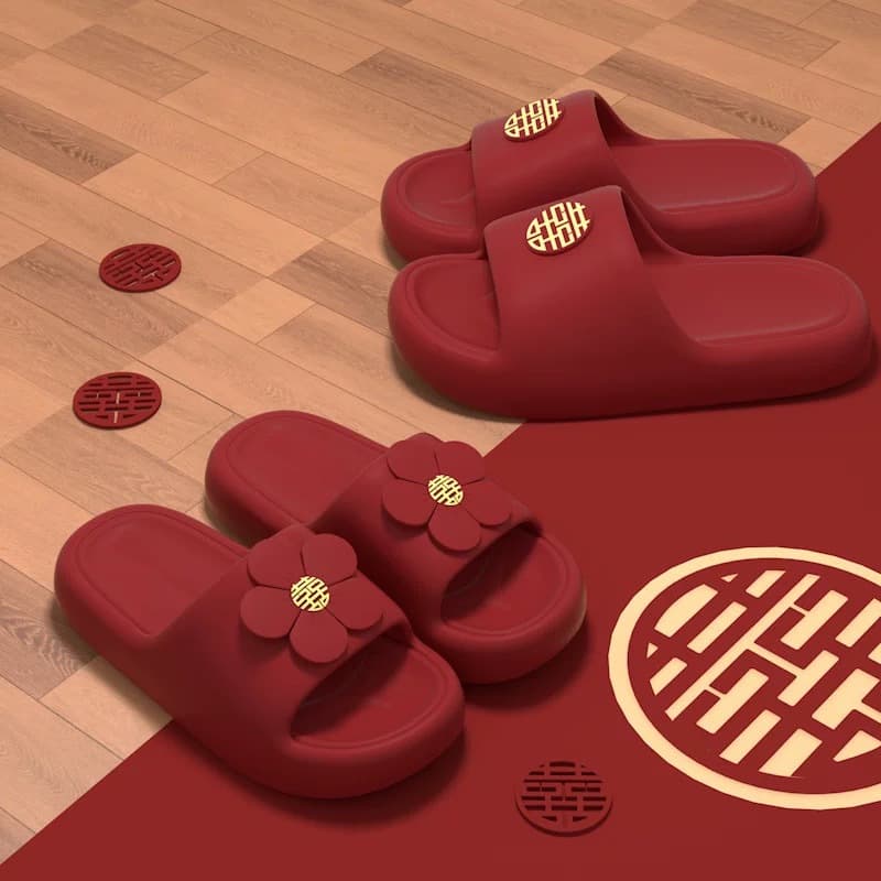 Couple's festive red EVA slippers with hot-stamped bows, offering a soft 'step-on-feces' feel, ideal for bride and groom's home use or summer wedding shoes.