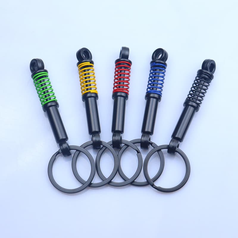 Creative car gift keychain modified shock absorber shock absorber spring pressable keychain model laser LOGO