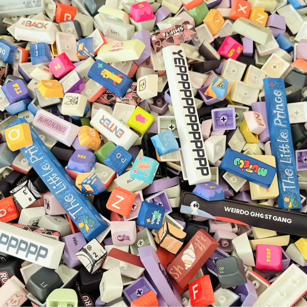 Customizable keyboards using PBT dye-sublimated keycaps (junk pack), featuring randomized key height, key layout, and color.
