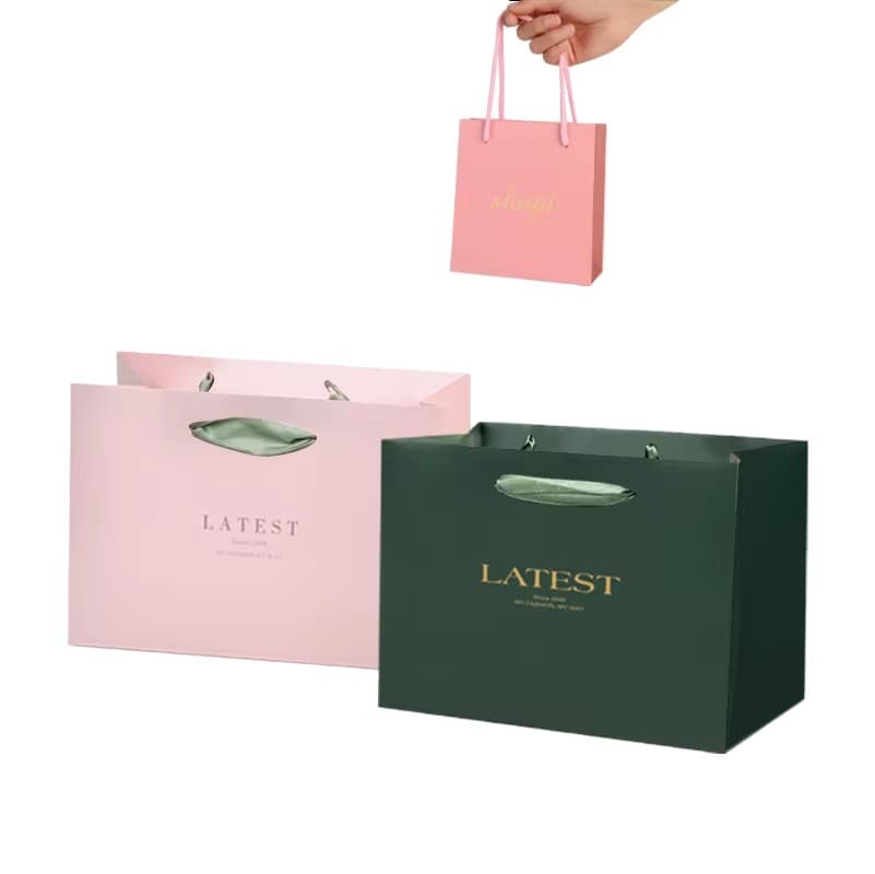 Printed LOGO elegant white black gift paper bag pink luxury clothing boutique paper bag with ribbon handle