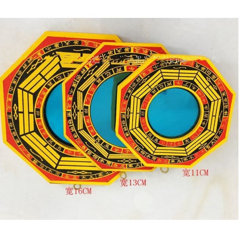 Small-sized outdoor door and window hanging ornament with a convex and concave Bagua mirror on a wooden board for home use.