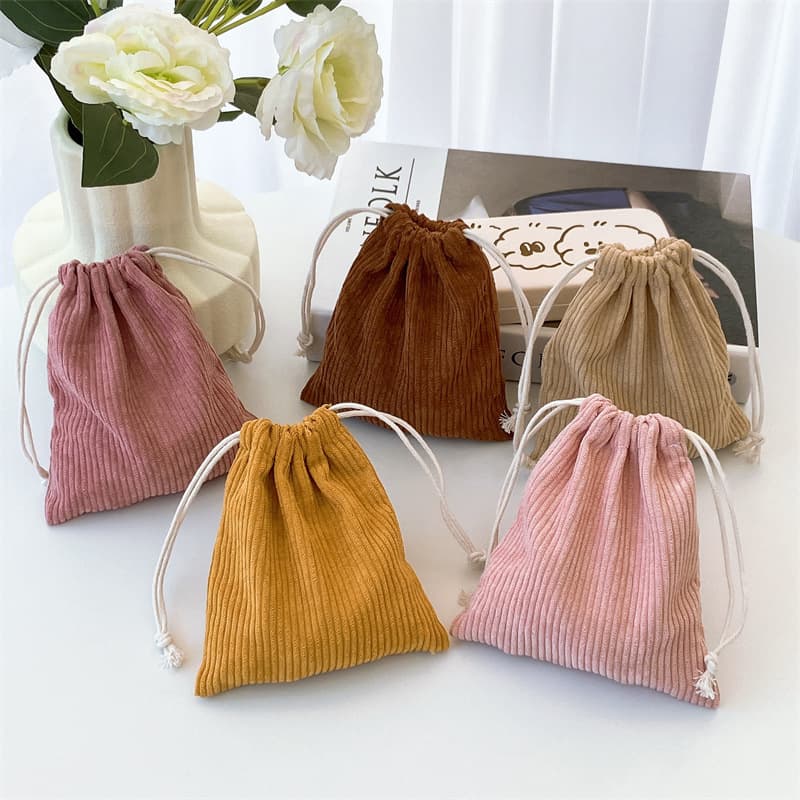 Retro corduroy drawstring pouch for jewelry, cosmetics, and other accessories; portable and large capacity coin purse.