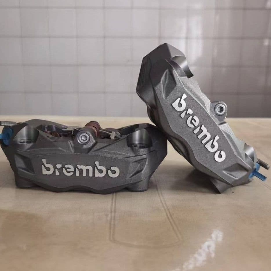 Domestically produced precision-engineered Brake calipers with 100mm locking point for electric motorcycle modification (black, red, gray, silver).