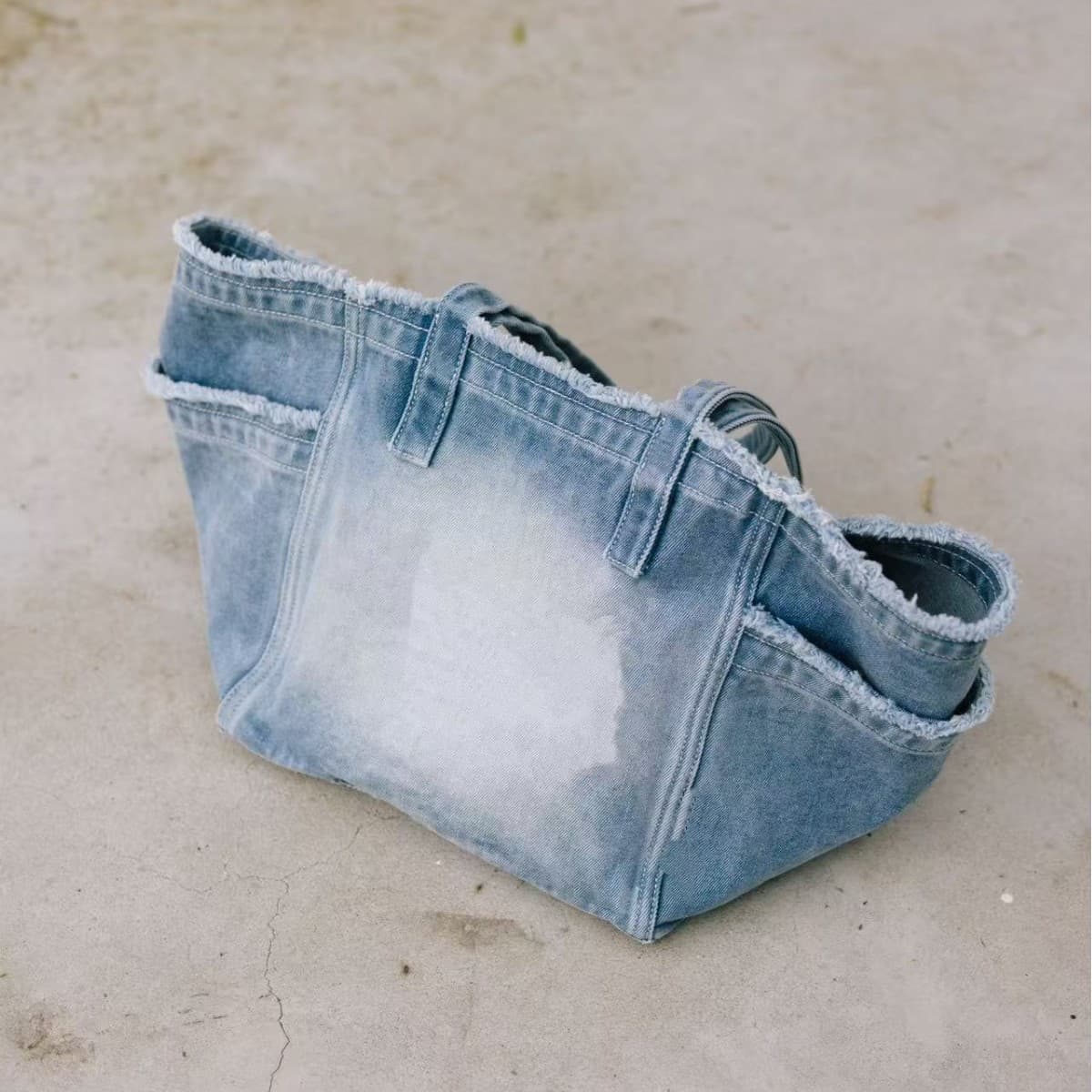 Internet celebrity same style spring and summer denim tassel fashion commuter portable one-shoulder distressed bag for women