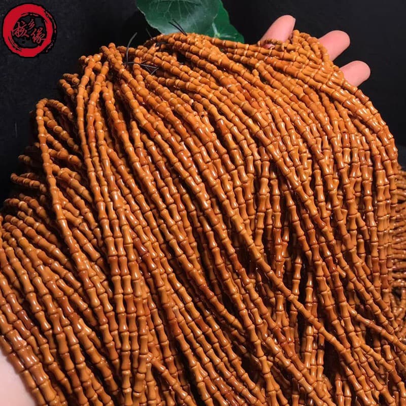 Hexiangyuan Factory supplies olive pit bamboo joint spacers for a 108-bead bracelet.