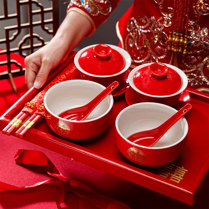The bride's new address to her husband during the wedding ceremony: a teacup, wedding bowls and chopsticks, a covered bowl, and a dowry gift set for her best friend.