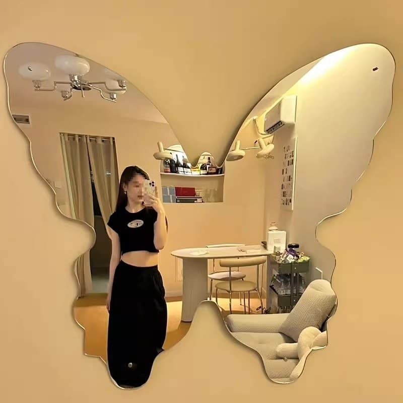 Self-adhesive wall-mounted makeup mirror with butterfly design, irregular shape for dormitories and bedrooms, soft material.