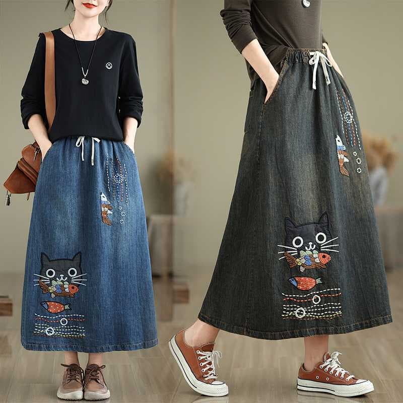 Real shot of a new loose-fitting embroidered denim washed long skirt for autumn.