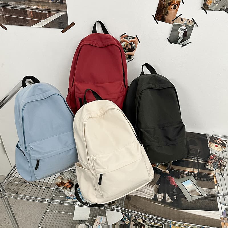 Japanese-style minimalist backpack for men and women, Korean version, large capacity solid color backpack for middle and high school students