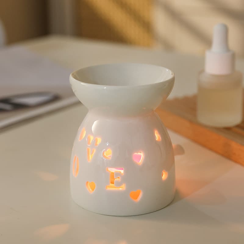 Factory direct supply candle essential oil aromatherapy furnace ceramic aromatherapy lamp multi-flower hollow cute version small porcelain household incense furnace