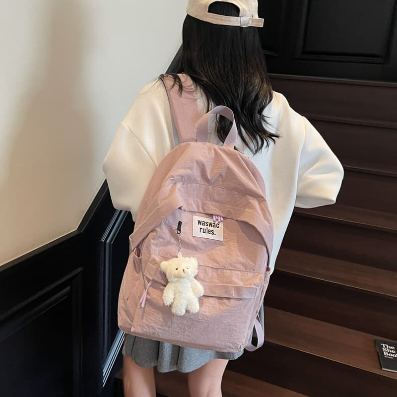 Korean-style large-capacity letter-print solid casual backpack for middle and high school students, commuting, stylish design