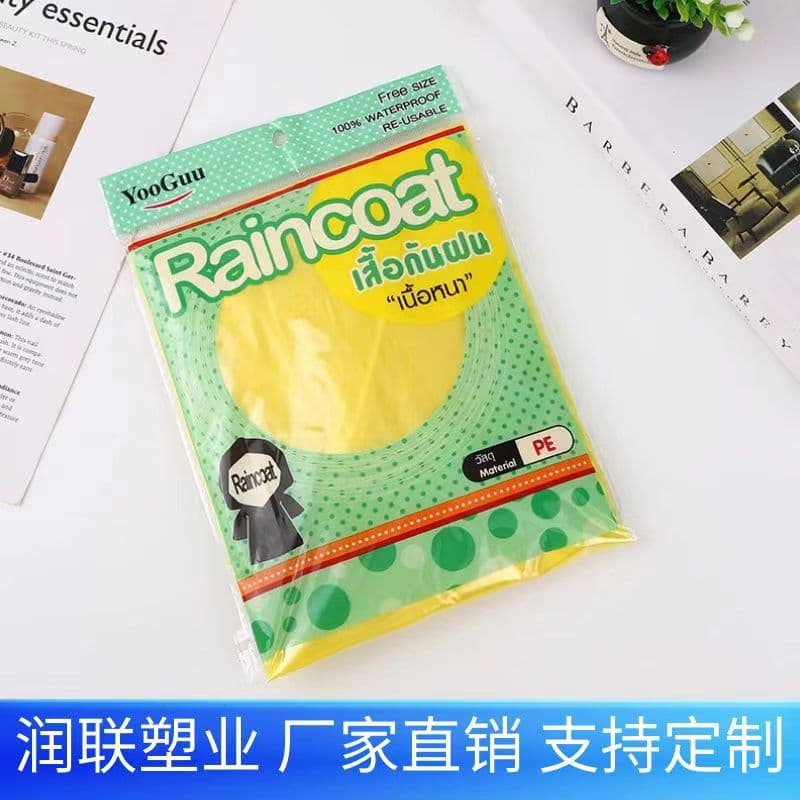 Factory Direct Thai Language Bag Thailand Raincoat Disposable Thickened Pullover Hood with Drawstring Elastic 80g Export