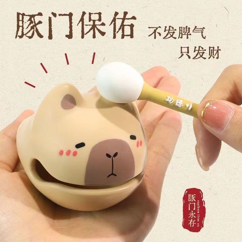 Cute cartoon Kapibala wooden fish percussion instrument for stress relief and mood improvement. A decorative toy for your office desk, perfect for tapping or hanging.