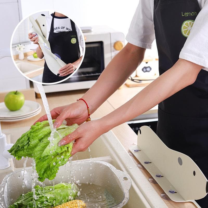 Cute polar bear-shaped water splash guard for kitchen sinks and dishwashing basins. Silicone suction cup water splash guard.