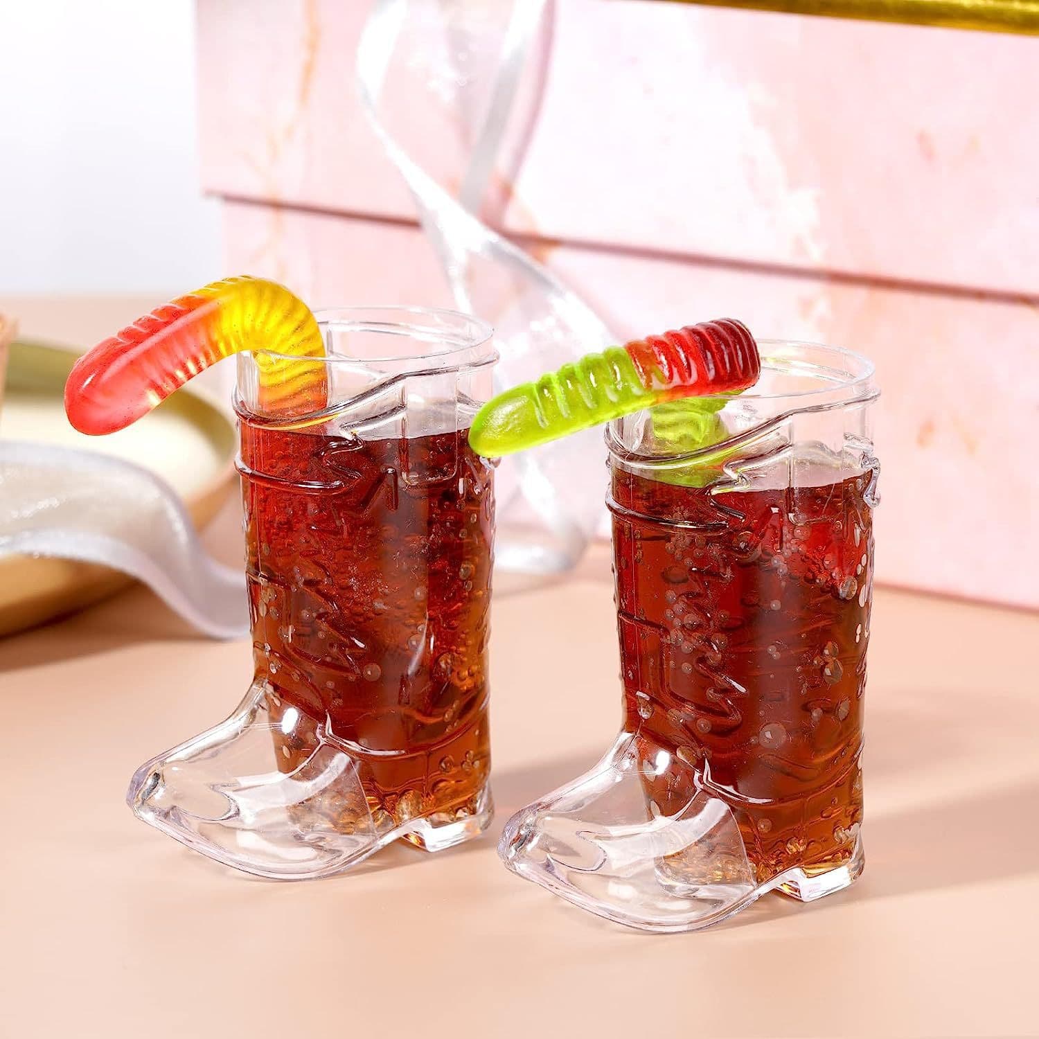 New bachelorette party supplies: cowboy boots, plastic wine glasses, Western cowboy themed party drinks, transparent small wine glasses