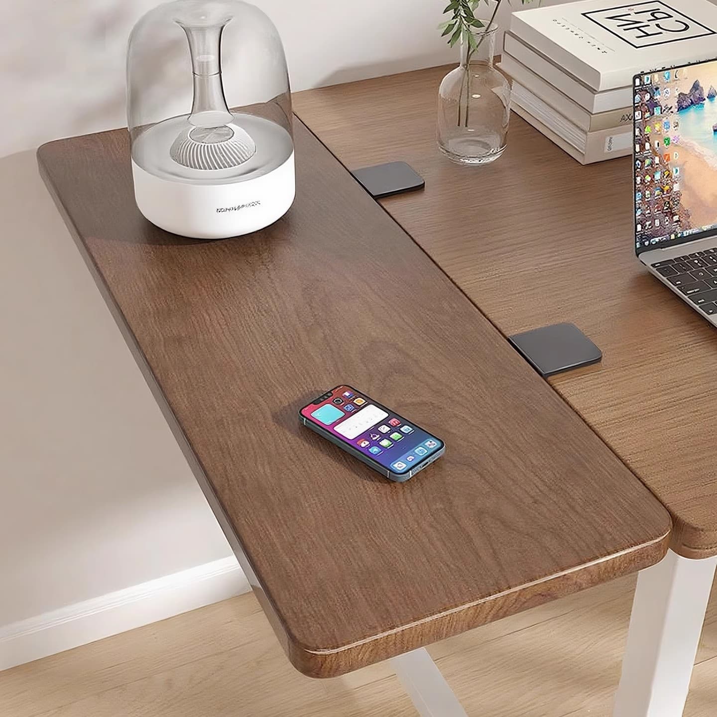 Foldable desktop extension board with side-expanding armrest, keyboard tray, and desk enlargement tool.
