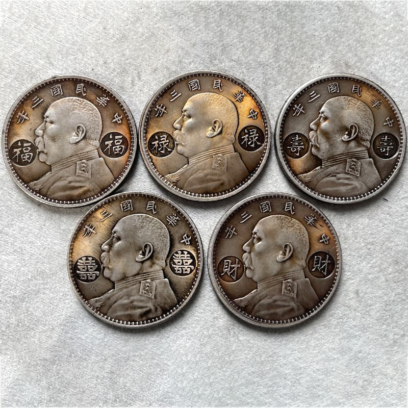 Silver-plated coins with a rich patina, featuring the auspicious symbolism of fortune, prosperity, longevity, happiness, and wealth – a perfect gift.