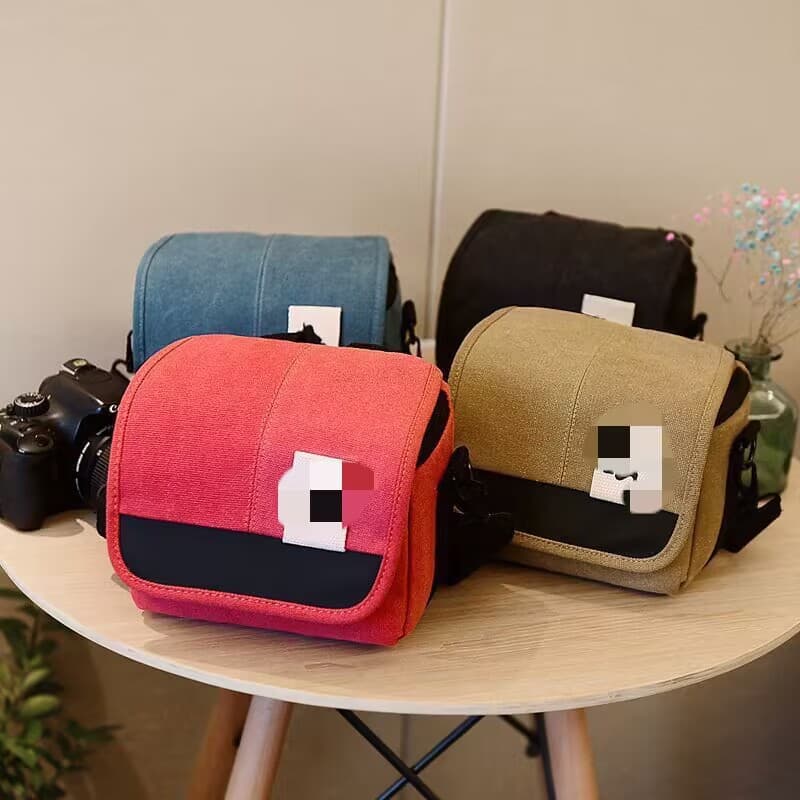 Wholesale canvas camera bags for mirrorless cameras, home DV camcorders, outdoor camera bags, and digital shoulder cameras.