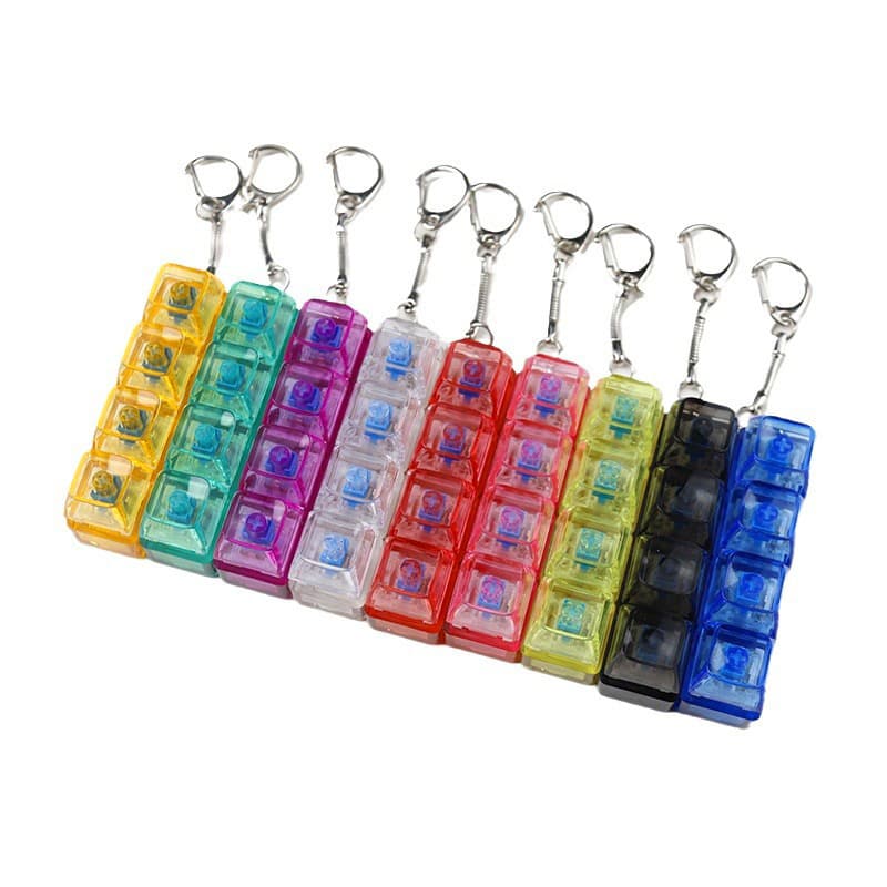 PC transparent material decompression tester, makes a crisp sound when pressed, 2-hole, 3-hole, 4-hole keychain with light and transparent cap.