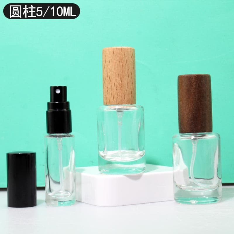 Cylindrical perfume bottles, 5ml and 10ml, screw-top clear glass spray bottles, high-end perfume dispensing bottles wholesale.