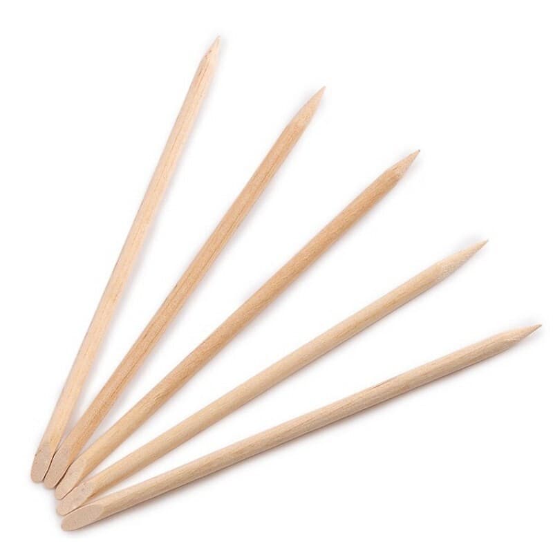 Nail art tool kit with smooth, thorn-free orange wood sticks, rhinestone sticks, small wooden pushers, nail remover sticks, and cuticle remover.