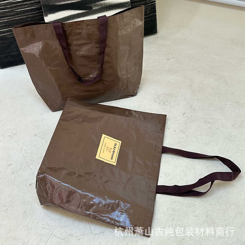 Laminated woven bag handbag, custom logo clothing store handbag, stock wholesale clothing handbag gift bag