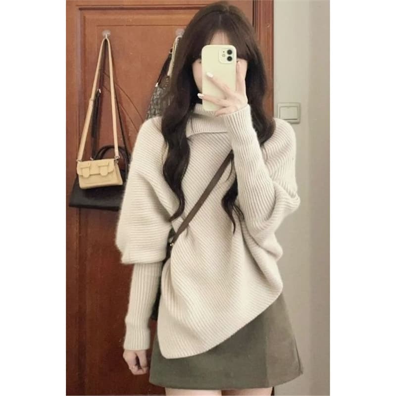 Irregularly styled sexy sweater set for women, autumn and winter, featuring a relaxed and loose knit top and high-waisted skirt.