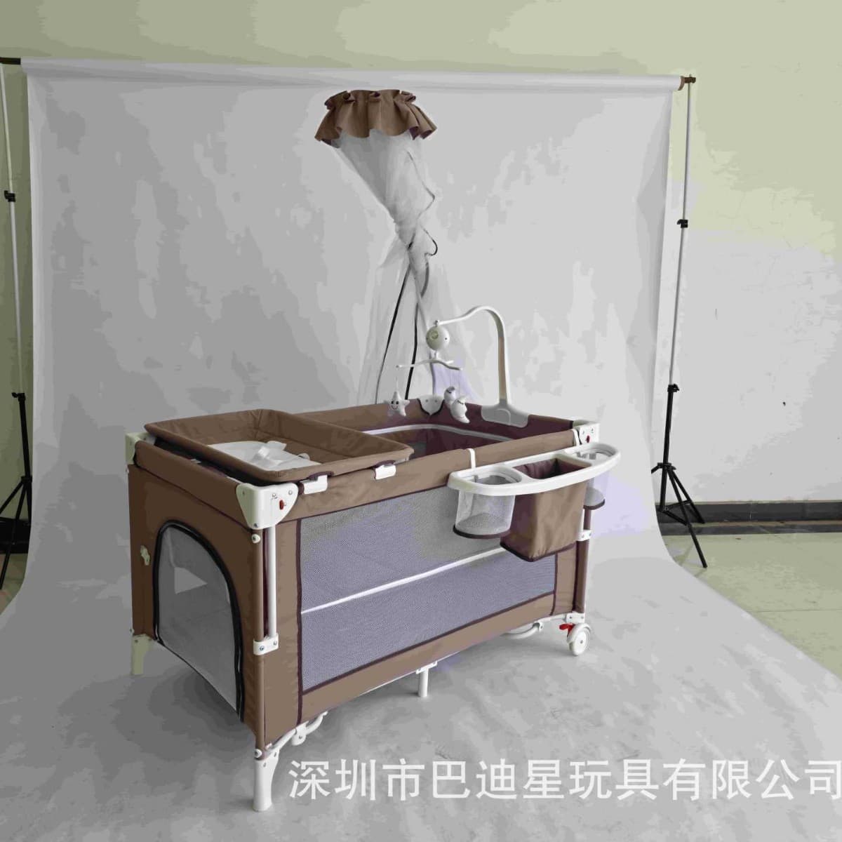 Cross-border travel portable baby crib with adjustable height, mosquito net, storage shelf, diaper changing station, and bassinet for export