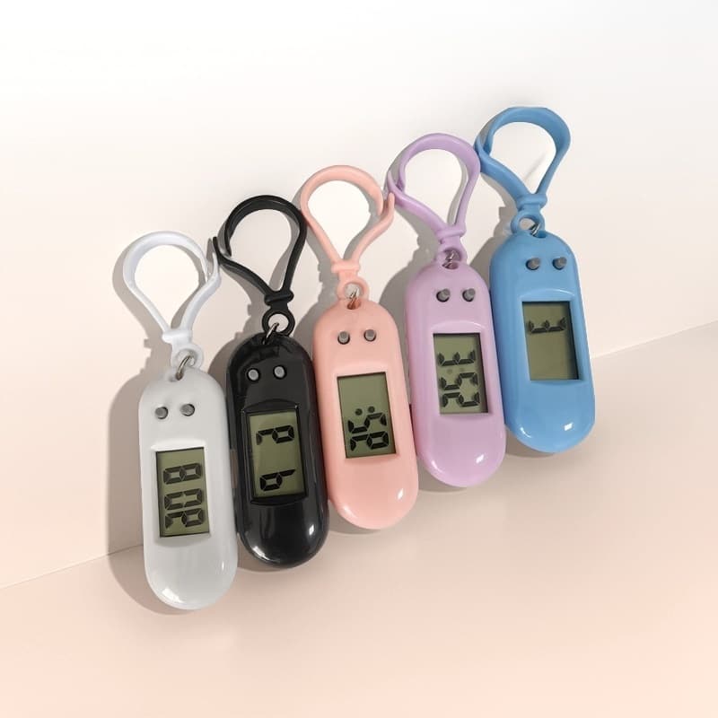Factory direct sales of oval keychain electronic clocks, silent small clocks for students and students, perfect for exams, portable desktops.