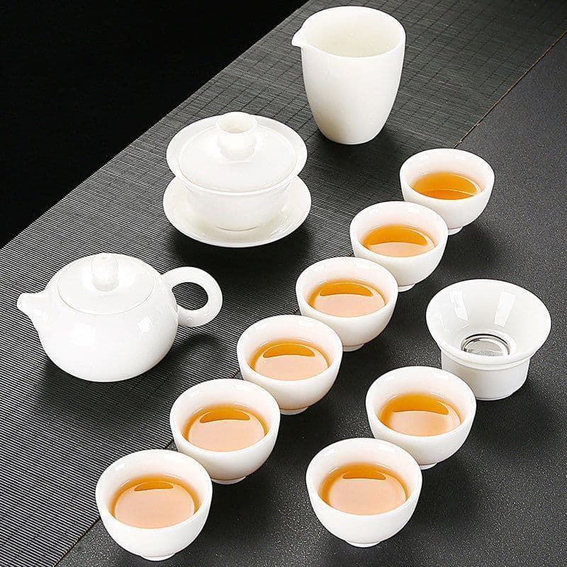 Mutton fat jade white porcelain Kung Fu tea set set, including gaiwan and teacups, for home, office, and entertaining purposes. (Supply chain)
