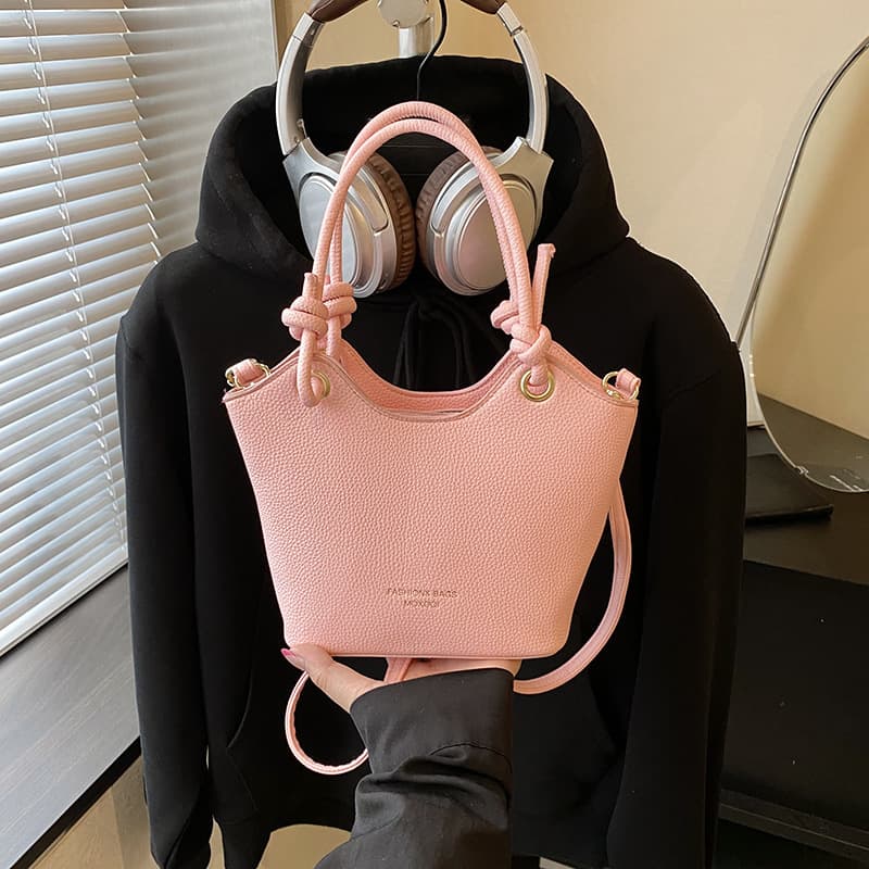 Textured women's design commuting cross-body portable bucket bag 2026 summer solid color new style simple fashion pendant foreign style