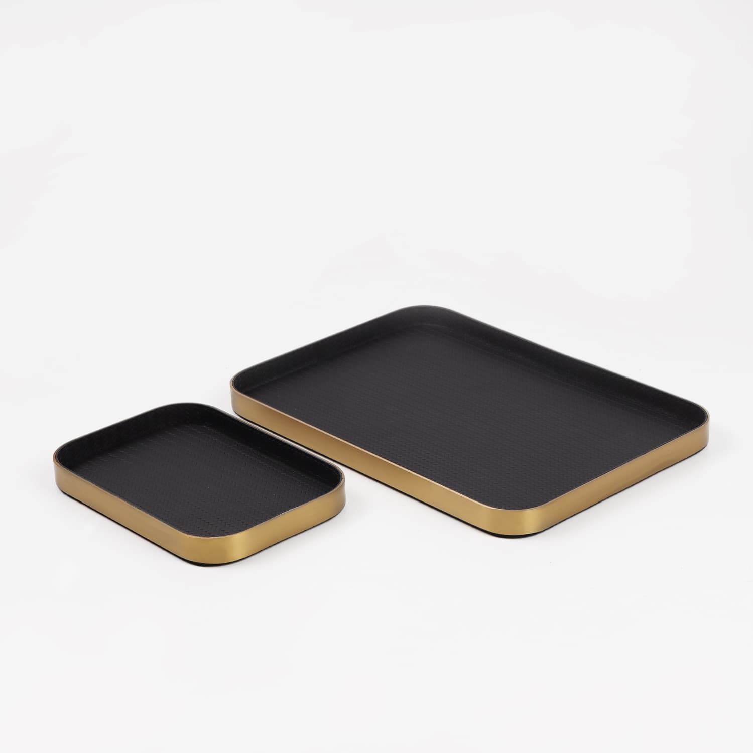 Modern minimalist leather-textured metal stainless steel trays, luxury model home sales office entryway key collection plates.