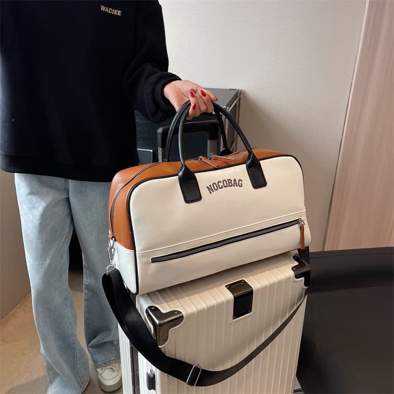 New short-distance women's travel bag, simple and versatile, shoulder crossbody portable fitness bag, men's storage bag, boarding bag wholesale