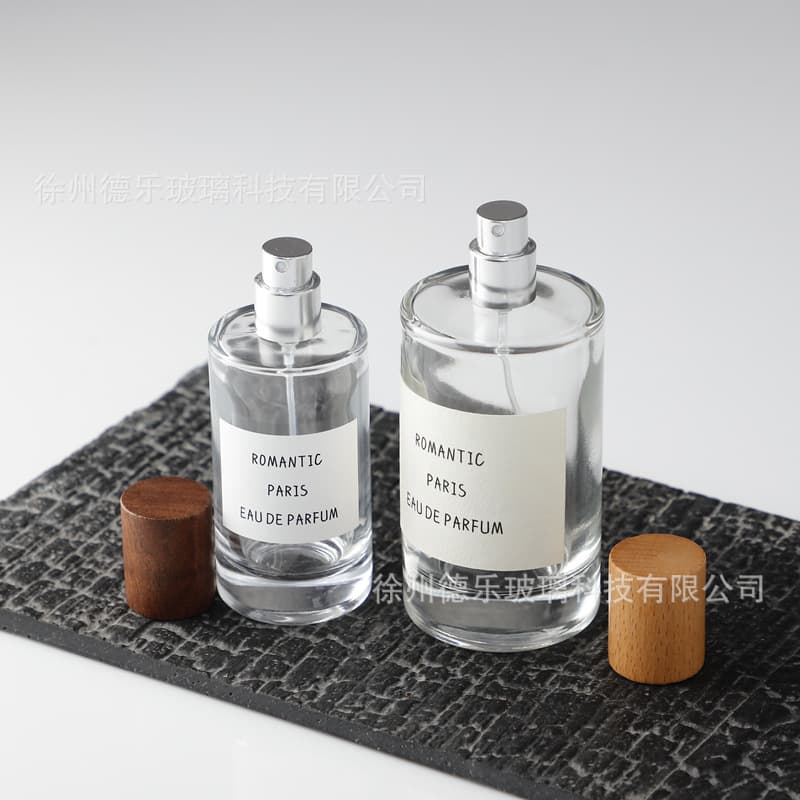 Wholesale wooden cap perfume bottle simple transparent cylindrical perfume bottle 50ml 80ml 100ml perfume bottle