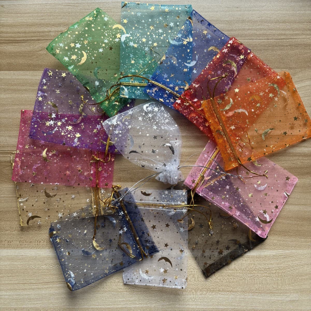 Mesh bag with gold and silver foil stamping, star and moon design, drawstring closure for jewelry, gifts, cosmetics, and storage.