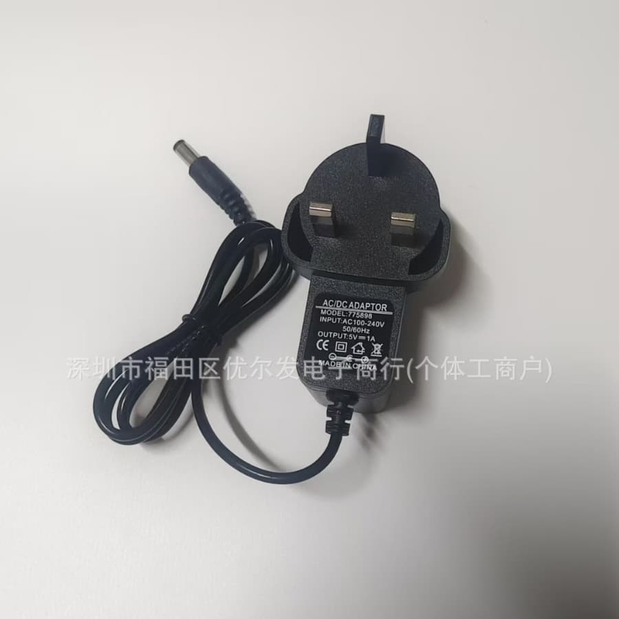 UK standard DC 3V/5V/6V/7.5V/9V/12V/15V 1A/2A power adapter charging cable with UK/Hong Kong triangular plug.