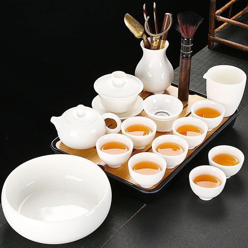 Dehua mutton fat jade white porcelain Kung Fu tea set, complete set of gaiwan and teacups, for home, office, and entertaining tea.