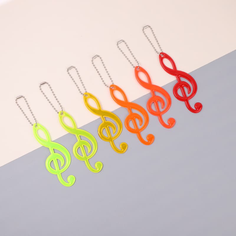 Cross-border 12-color musical note reflective safety warning pendant, nighttime PVC keychain backpack charm