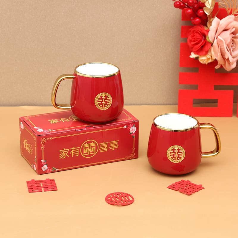 Chinese-style wedding tea set for the bride's family, including a pair of ceramic cups symbolizing union, as a dowry and celebration gift.