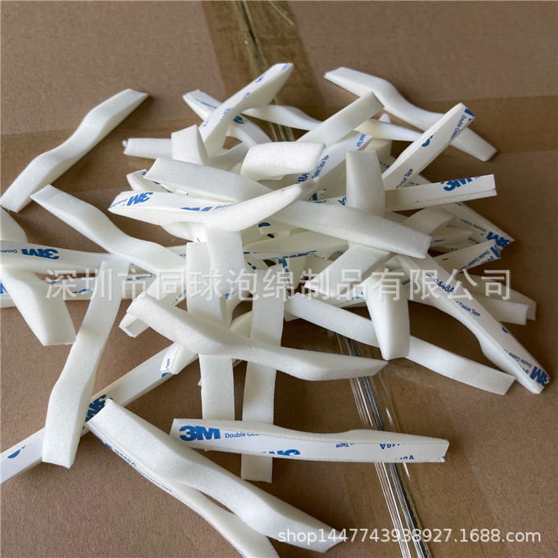 100mm white slow rebound sponge nose bridge strip mask, with M-shaped adhesive backing and soft cotton strip pressed into a ball.