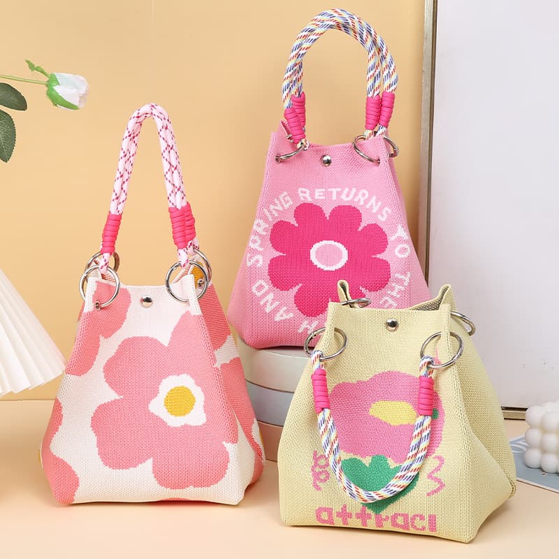 Customized cute knitted bags with magnetic snap closures, suitable for work, commuting, and casual wear. Large capacity bucket bags and woven tote bags available for wholesale.