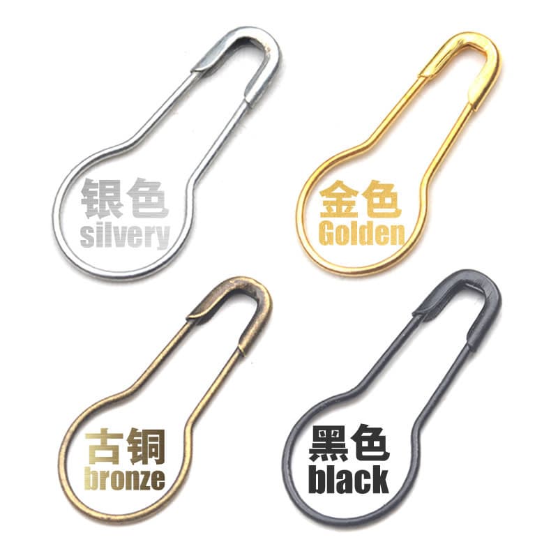 Small black, gold, and silver gourd-shaped metal brooch pin with clasp for securing clothing, household tags, and pendants, suitable for independent displays.