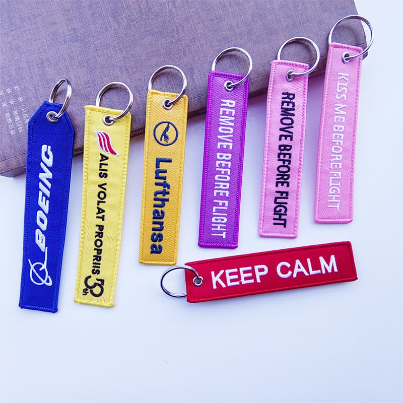 Custom 3D Embroidered Logo Keychain DIY Aviation Lock Edge Fabric Strip Woven Label Key Ring Bag Accessory Tag