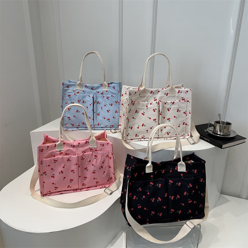2024 autumn new Korean style trendy personalized minimalist strawberry print large capacity canvas student class bag for women.
