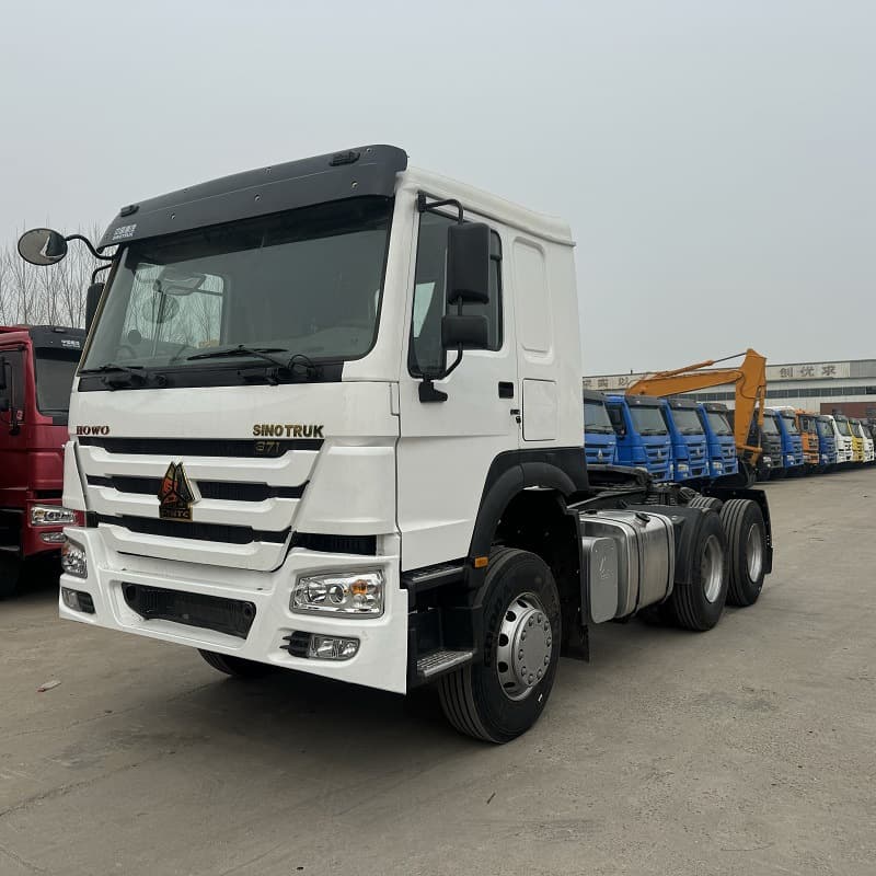Rear eight-wheel Howo tractor head for sale, dual-drive cargo transport truck, 375HP tractor truck