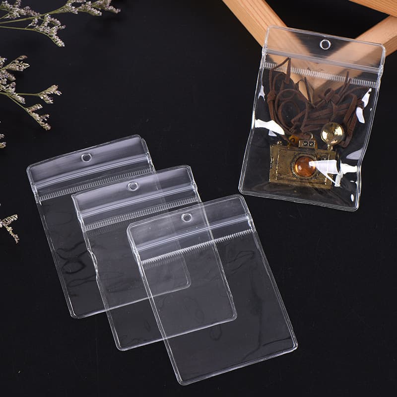 Portable small jewelry bag for earrings, including plastic bags, earring and ring storage bags, and PVC resealable bags.