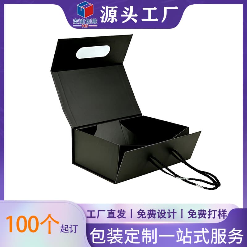 Luxury matte black and gold foil logo coated paper folding magnetic gift box made from recycled materials with a glossy finish.